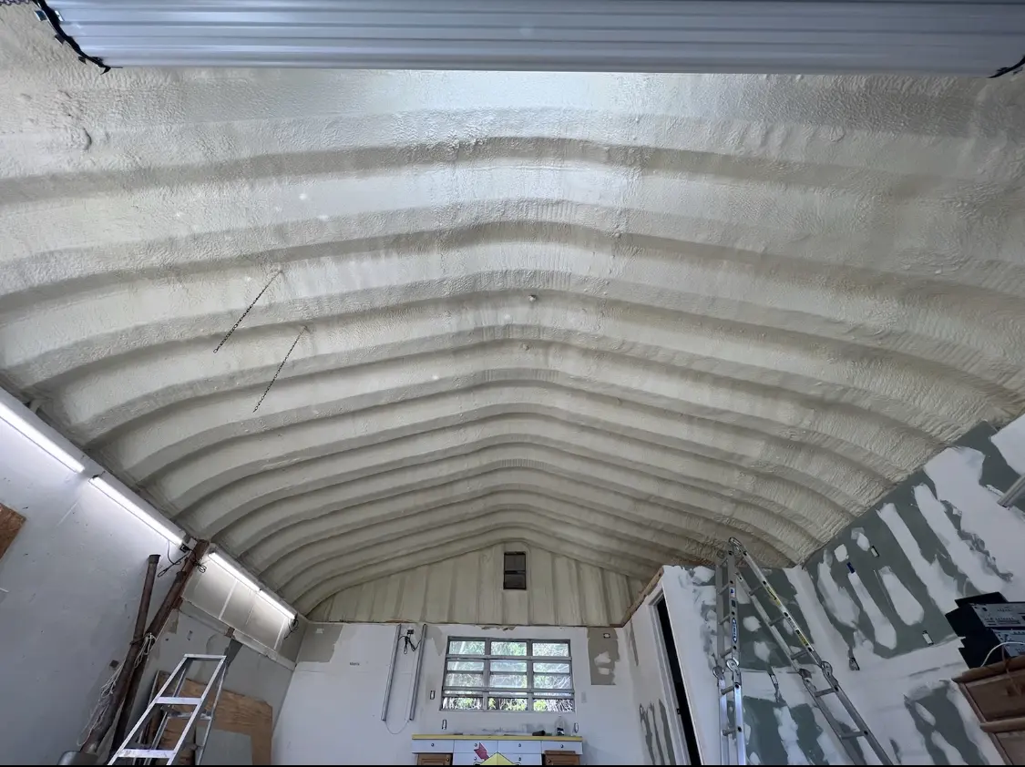 Spray polyurethane foam applied to the underside of a metal roof deck in Gardiner